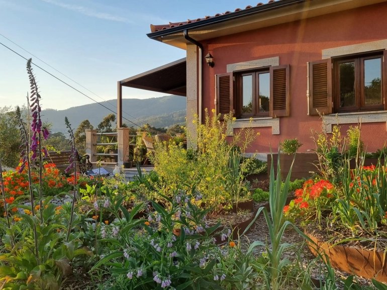 The property exterior — gardens and mountain views